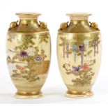 A PAIR OF JAPANESE SATSUMA EARTHENWARE VASES OF SHOULDERED FORM WITH DRUM HANDLES, DECORATED WITH