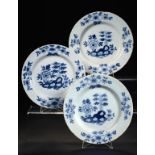 THREE ENGLISH DELFTWARE PLATES, PROBABLY BRISTOL, C1760 painted in cobalt with a Peony and Rock