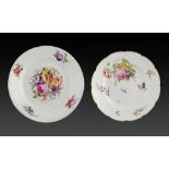 TWO DERBY PLATES, C1815-20 both painted with flowers, the scalloped smaller plate with basket