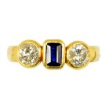 A SAPPHIRE AND DIAMOND THREE STONE RING in gold marked 750, 4.4g, size M ++In satisfactory second