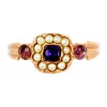 AN AMETHYST AND SPLIT PEARL CLUSTER RING in 9ct gold with fluted shoulders, London hallmark, 2.2g,