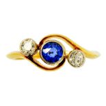 A SAPPHIRE AND DIAMOND THREE STONE CROSSOVER RING in gold, marked 18CT, 2.9g, size M ++In