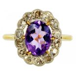 AN AMETHYST AND DIAMOND CLUSTER RING in gold, marked 18ct & PT, 3.1g, size L ½ ++In satisfactory