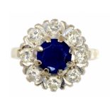 A SAPPHIRE AND DIAMOND CLUSTER RING in 18ct gold, London 1974, 5.3g, size N ++Hoop slightly bent