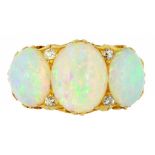 AN OPAL THREE STONE RING with four evenly sized small old cut diamonds, in gold, unmarked, 6.9g,