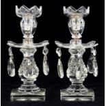 A PAIR OF CUT GLASS LUSTRE CANDLESTICKS, ON SQUARE STAR CUT FOOT, 24CM H, C1900