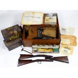 THREE WALNUT OR MAHOGANY GUN STOCKS, A SHOTGUN CLEANING SET BY PARKER-HALE card box, three metal
