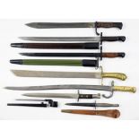 SIX VARIOUS BAYONETS, LATE 19TH C AND LATER a Fairbairn Sykes pattern fighting knife and leather