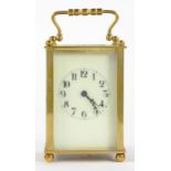 A FRENCH BRASS CARRIAGE TIMEPIECE WITH PRIMROSE ENAMEL DIAL, 10.5CM H, LEATHER CASE, EARLY 20TH C