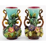 A PAIR OF FLORAL ENCRUSTED MAJOLICA VASES, WITH FLARED NECK AND SCROLL HANDLES, 25CM H, LATE 19TH C