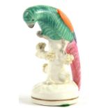A STAFFORDSHIRE EARTHENWARE MODEL OF A PARROT, DECORATED IN COLOURS, 10CM H, C1860