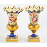 A PAIR OF STAFFORDSHIRE PORCELAIN BLUE GROUND VASES, PAINTED WITH PANELS OF FLOWERS AND GILT, ON