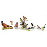 A SITZENDORF PORCELAIN GROUP OF FOUR BIRDS ON A STUMP, 24CM H, A BESWICK PHEASANT AND SIX VARIOUS