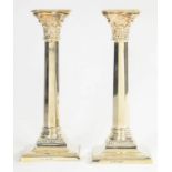 A PAIR OF GEORGE V SILVER COLUMNAR CANDLESTICKS WITH NOZZLES, 23CM H, BIRMINGHAM 1932, 14OZS 10DWTS