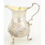 A GEORGE III SILVER CREAM JUG ON THREE FEET, LATER CHASED, 10CM H, LONDON 1761, 2OZS 10DWTS