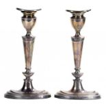 A PAIR OF ELIZABETH II SILVER CANDLESTICKS nozzles, 20.5cm h, by D J Silver, London 1968, loaded++In