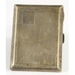 A GEORGE V SILVER CIGARETTE CASE, ENGINE TURNED, 8.5CM W, BIRMINGHAM 1925, 3OZS