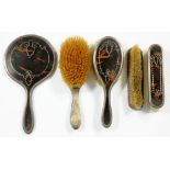 A GEORGE V SILVER FIVE PIECE BRUSH SET, WITH SILVER INLAID TORTOISESHELL INSET BACKS, LONDON 1923