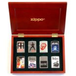 A BOXED SET OF SIX BEATLES, ELVIS AND OTHER COMMEMORATIVE ZIPPO LIGHTERS, BOX 24.5CM W