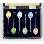 A SET OF SIX ELIZABETH II SILVER AND HARLEQUIN GUILLOCHE ENAMEL COFFEE SPOONS, WITH BEAN TERMINAL,