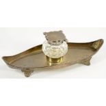 A VICTORIAN SILVER MOUNTED CUT GLASS INKWELL, ON BOAT SHAPED TRAY, 21CM W, LONDON 1897