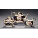 A COALPORT COBALT GROUND TEAPOT, COVER AND STAND, SUCRIER AND COVER AND CREAM JUG, C1820 painted