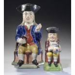 A STAFFORDSHIRE PEARLWARE TOBY JUG OF UNUSUAL SMALL SIZE, C1820 the toper in rust coloured coat