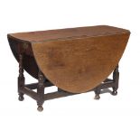 A GEORGE III OAK GATELEG TABLE on turned underframe, 73cm h; 131 x 158cm ++In sound condition, minor