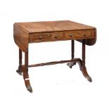 A GEORGE IV MAHOGANY SOFA TABLE the figured top with drawers and opposing blind drawers, on spirally
