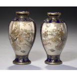 A PAIR OF SATSUMA BLUE GROUND EARTHENWARE LOBED OVIFORM VASES, MEIJI PERIOD enamelled to either side