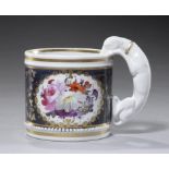 AN ENGLISH PORCELAIN HOUND HANDLED MUG, C1820 painted with panels of flowers reserved on a cobalt