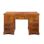 A SATINWOOD DESK, EARLY 20TH C the crossbanded and line inlaid top in matched veneers, fitted with