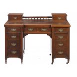 A VICTORIAN MAHOGANY INVERTED BREAKFRONT PEDESTAL DESK, C1890 the leather inlet top with galleried