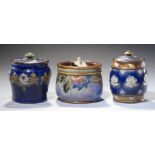 THREE DOULTON WARE TOBACCO JARS AND COVERS, C1910-20 12cm h and c, impressed marks and incised