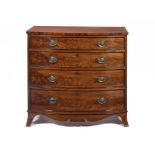 A GEORGE IV MAHOGANY BOW FRONTED CHEST OF DRAWERS with ebonised mouldings and oval brass handles,