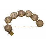 A VICTORIAN GOLD BRACELET, C1870 in seven sections each set with a contemporary photograph (albumen)