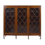 AN INLAID MAHOGANY BOOKCASE, C1900 fitted with adjustable shelves enclosed by three doors with