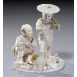 A JAPANESE IVORY GROUP OF TWO ARTISANS, MEIJI PERIOD 10cm h, signed Shungyoku, ++Slight damage and