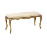 A FRENCH GILTWOOD DUET STOOL IN LOUIS XV STYLE, C1900 50cm h; 38 x 106cm ++Gilding/gesso flaking and