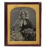 PHOTOGRAPHY. A QUARTER PLATE AMBROTYPE OF A LADY BY JAMES THOMAS FOARD, C1855 in maroon morocco