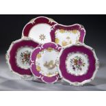 FOUR ROCKINGHAM CLARET GROUND PLATES AND A DESSERT DISH, C1830-42 various shapes and patterns,