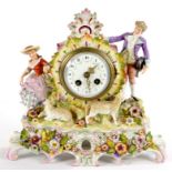 A SITZENDORF FLORAL ENCRUSTED PORCELAIN MANTLE CLOCK, FRENCH MOVEMENT WITH ENAMEL DIAL, IN DRUM CASE