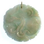 A CHINESE CARVED JADE PENDANT, 5CM D