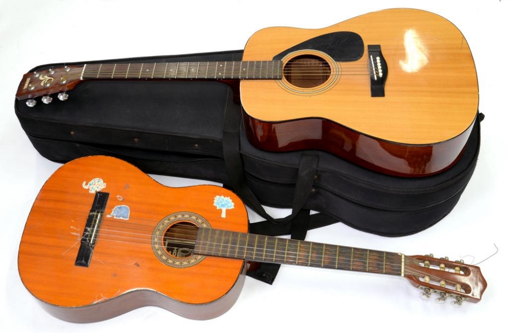 A YAMAHA GUITAR AND CASE AND ANOTHER GUITAR