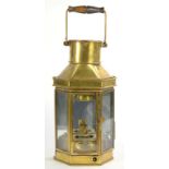 A BRASS MIRROR BACKED LANTERN WITH EBONISED BEECH SWING HANDLE AND OIL ILLUMINANT, 41CM H