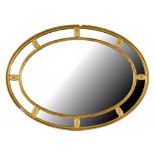 A GILTWOOD AND COMPOSITION OVAL MIRROR 98.5 X 72CM