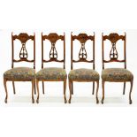 A SET OF FOUR EDWARD VII CARVED AND STAINED BEECH DINING CHAIRS, ON CABRIOLE FOUR LEGS