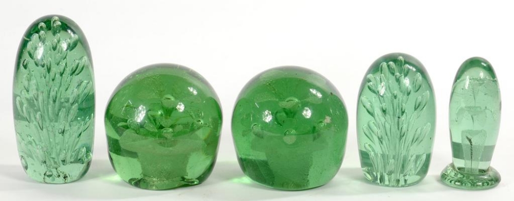 THREE AND A NEAR PAIR OF 19TH C GREEN GLASS 'DUMP' DOOR STOPS', LARGEST 15CM H