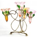 AN EPNS WIREWORK FLOWER STAND, WITH FOUR CRANBERRY TINTED AND 'PEACOCK' TRAILED GLASS VASES, 32CM H,