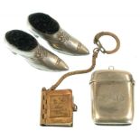 A PAIR OF LATE VICTORIAN PLATED METAL SHOE NOVELTY PIN CUSHIONS, A SILVER VESTA CASE, BIRMINGHAM